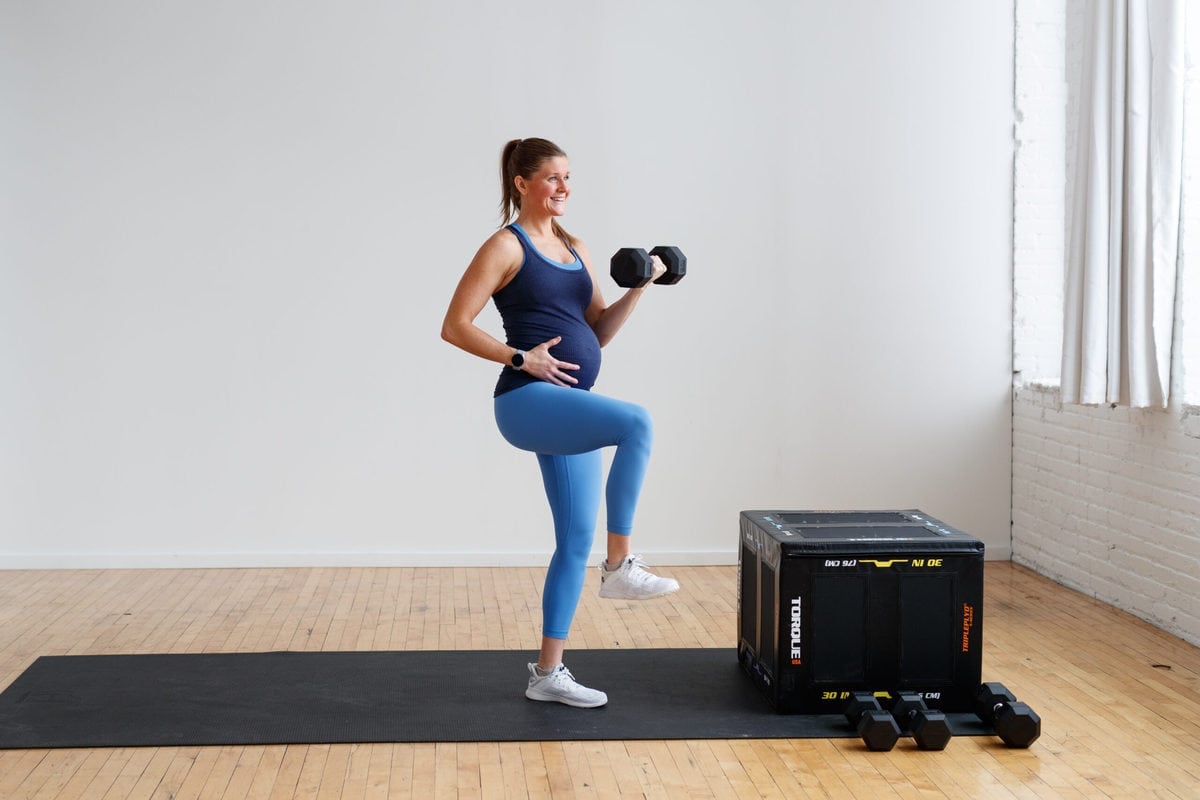 pregnant woman performing single arm bicep curl with text overlay "25-minute prenatal back and bicep workout" 
