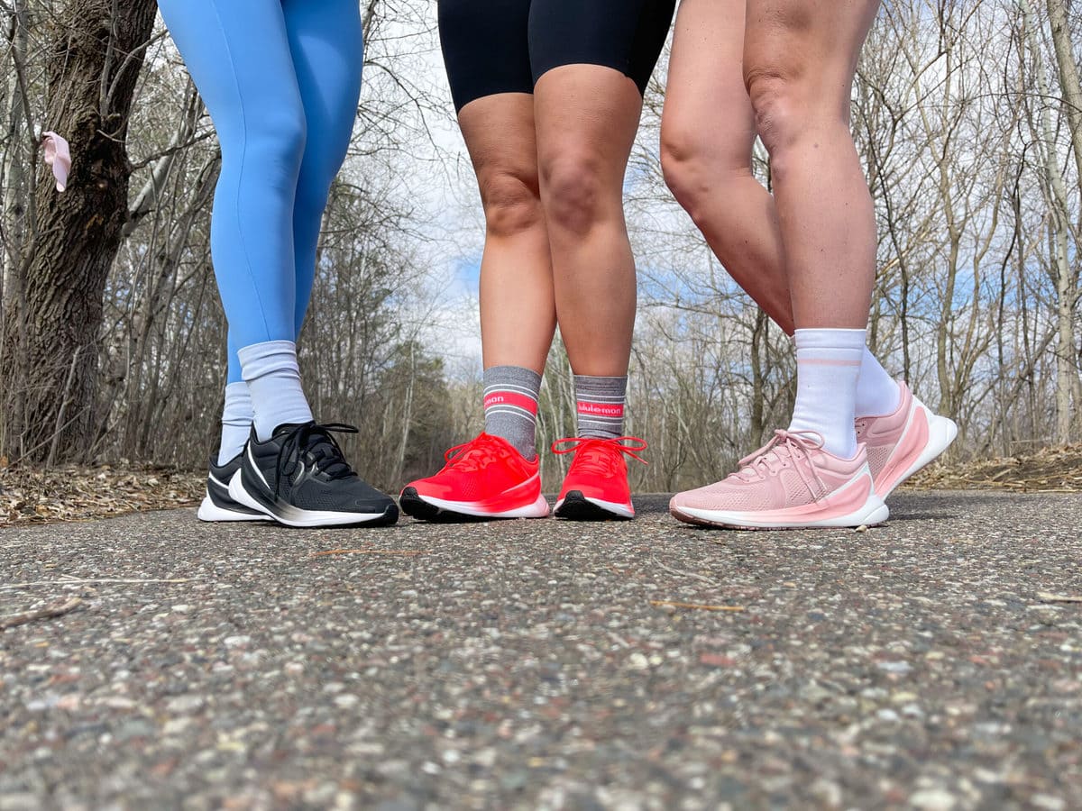 close up of lululemon shoes in 3 different colors: black, red and pink