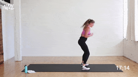 woman performing a burpee and two jabs