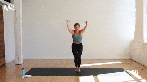 woman performing a chair pose and balance heel float