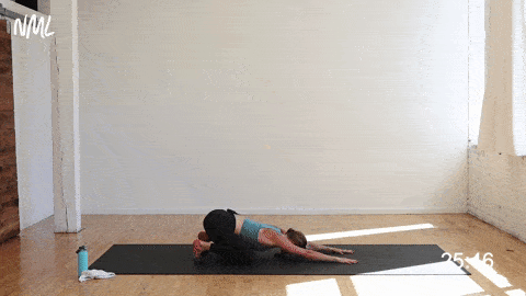 woman performing a child pose to high plank