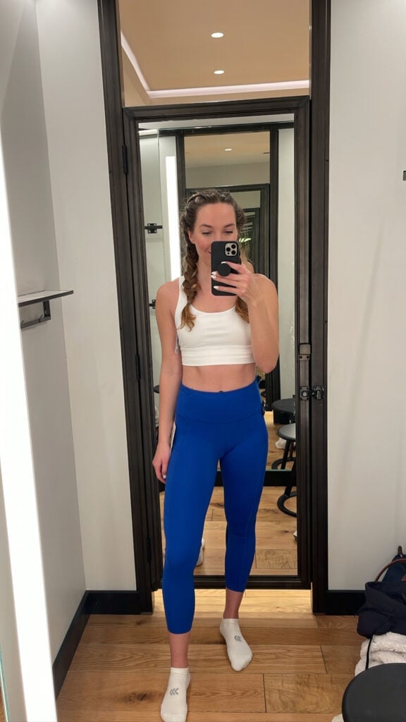 woman taking mirror selfie wearing Fast and Free tight from lululemon