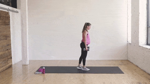 pregnant woman performing a front lunge into a reverse lunge
