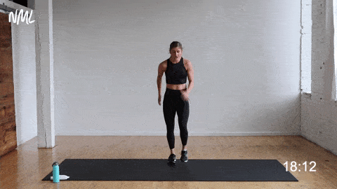 woman performing a front lunge and squat jump