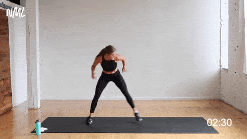 woman performing a lateral lunge and burpee