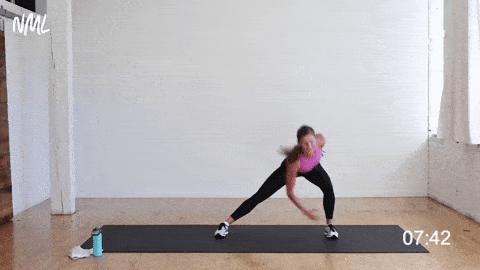 woman performing a lateral lunge and crunch