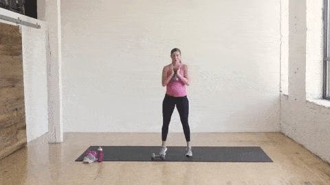 pregnant woman performing a squat and calf raise