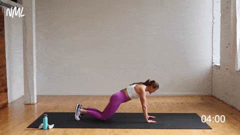 woman performing a wide push up to narrow push up