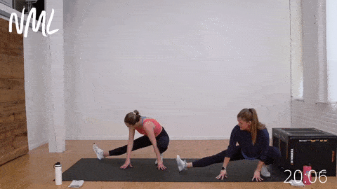 two women performing cossack squats as part of mobility workout