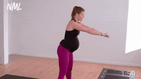 pregnant woman performing forward fold; pregnancy stretches