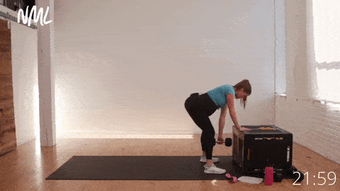 pregnant woman performing a deadlift and back row with a single heavy dumbbell