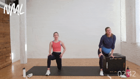 two women performing hip flexor stretches - one on the ground, and one using a box for assistance - as part of prenatal cardio workout