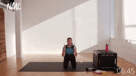 pregnant woman performing a kneeling shoulder press and tricep extensions; exercise for pregnant women