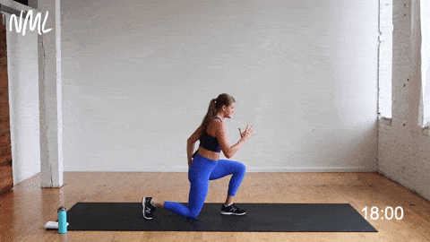 woman performing reverse lunge knee drive and rear leg lift
