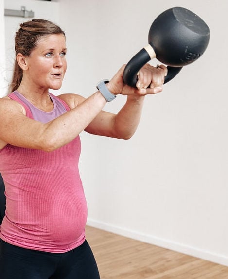 woman performing a kettlebell swing, shop my kettlebell