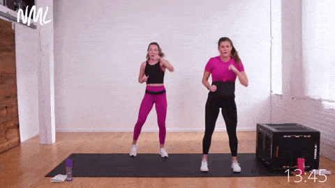 Two women performing a Lateral Squat Step + 2 Front Jabs, safe pregnancy exercises at home