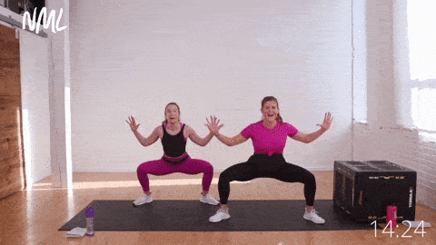 two women performing a sumo squat lat pull down, bodyweight prenatal workout