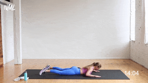 woman performing prone rear back flys