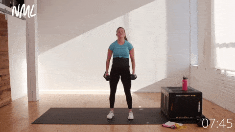 pregnant woman performing bicep curls and push press or overhead shoulder press
