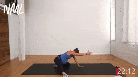 pregnant woman performing extended goddess pose in prenatal yoga
