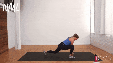 pregnant woman performing a low lunge and hamstring stretch in prenatal yoga routine