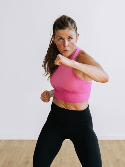 woman performing a crossbody punch