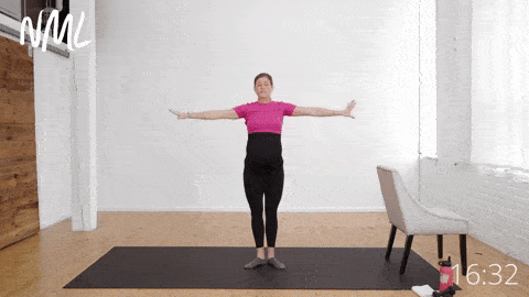 pregnant woman performing a first position series in barre workoutu