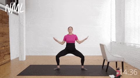 pregnant woman performing a Second Position Series as part of a pregnancy barre workout
