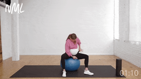 pregnant woman rolling adductor muscles in the inner thighs to reduce pelvic pain during pregnancy