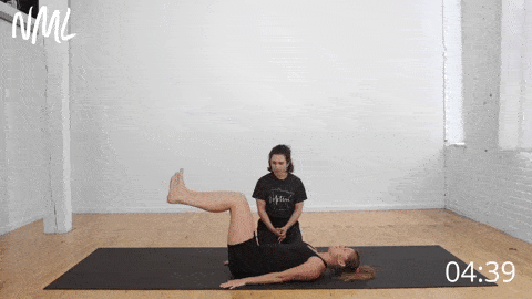 woman working with pelvic floor physical therapist to perform heel taps