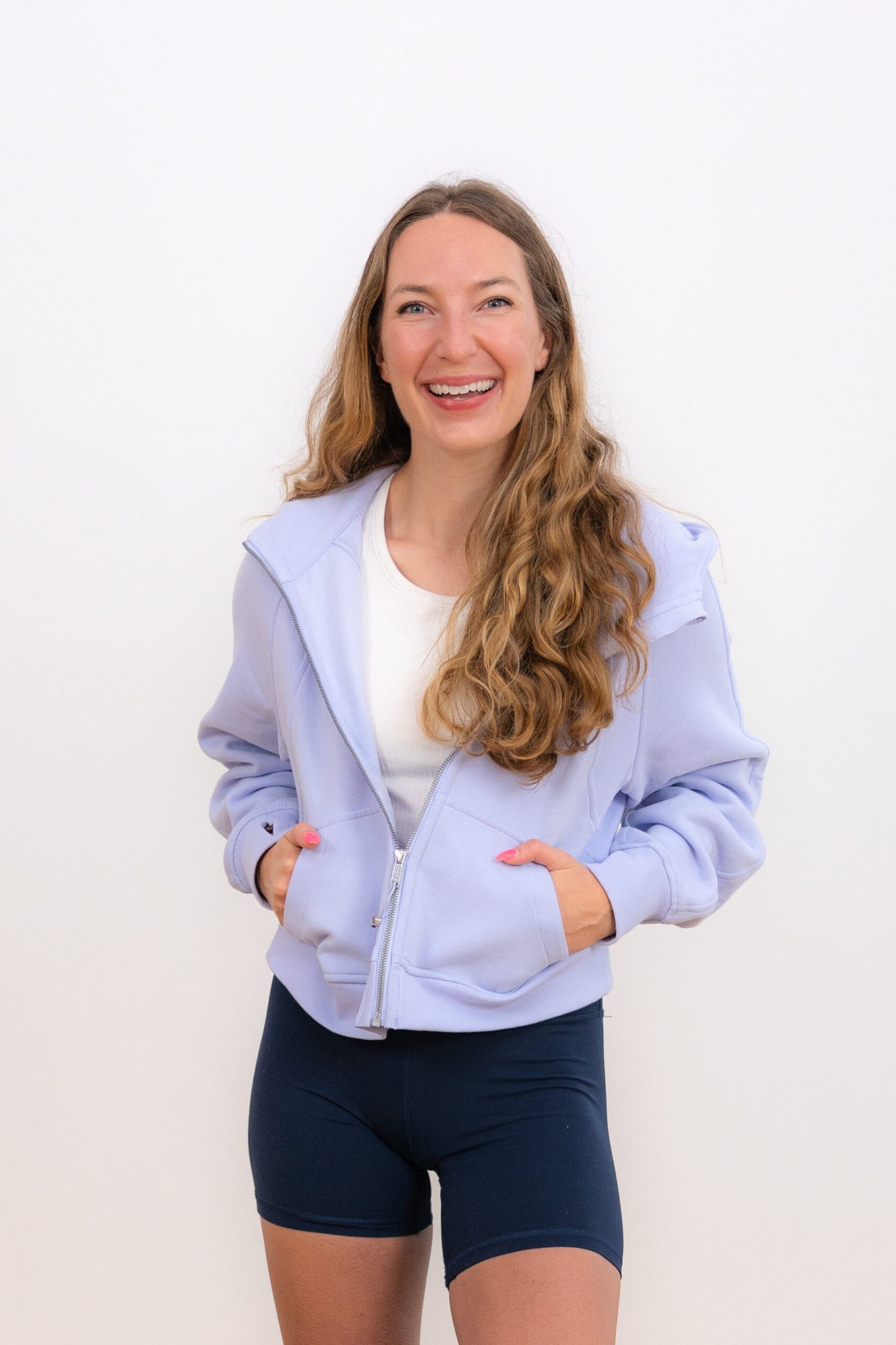 Woman wearing light blue Scuba zip lululemon sweatshirts