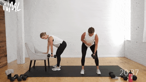 two women performing a bicep curl and back row as part of arm workout for beginners