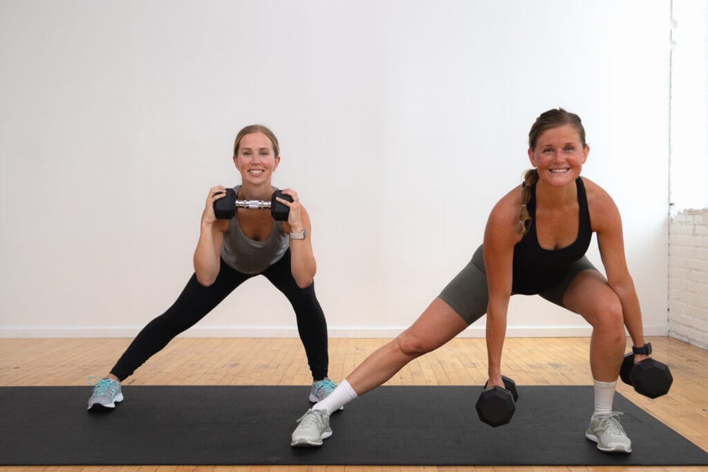 two women performing a lateral squat as part of beginner leg workout