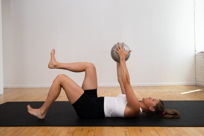 dead bug march exercise as part of beginner pilates ab workout