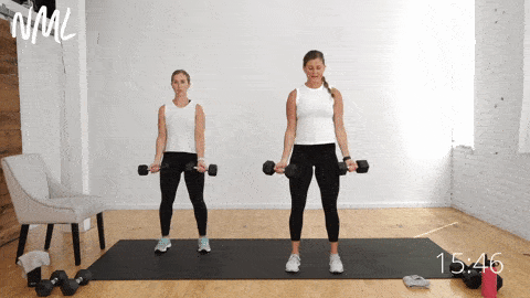 two women performing flip grip bicep curls as part of arm workout for beginners
