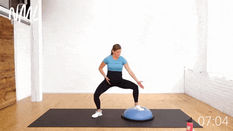 pregnant woman performing an uneven squat pulse as labor inducing exercise