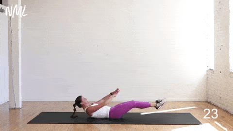 woman performing frog crunches in an advanced ab workout for women