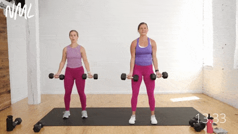 two women performing a bicep curl variation to target the arms as part of a strength training for beginners workout