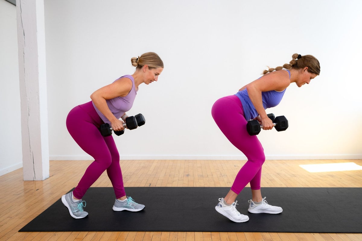 two women performing a dumbbell back row as part of a dumbbell workout for beginners