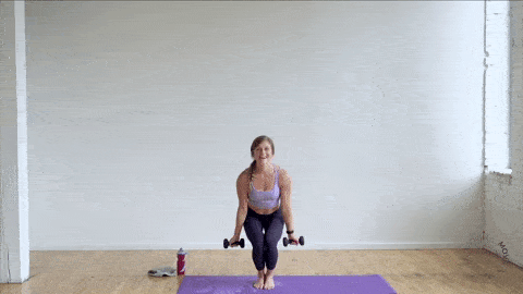 woman performing a chair squat and bicep curl and overhead shoulder press in a power barre fitness workout for women