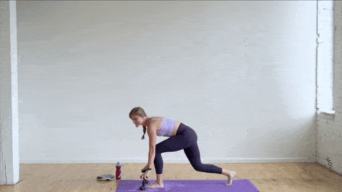 woman performing a low lunge and rear kick in a power barre fitness workout at home