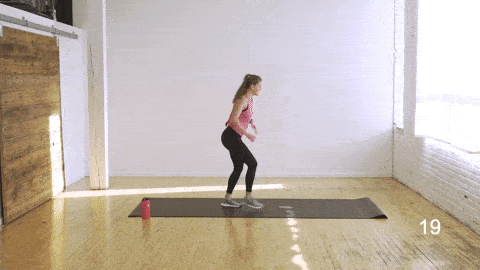 woman performing a lunge and rear leg lift and lunge and front kick in an abs and butt workout