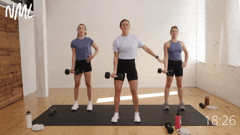 three women performing an eccentric single arm bicep curl as part of unilateral workout