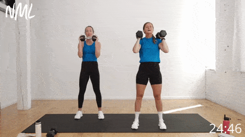 two women performing a front squat as example of weight training for women