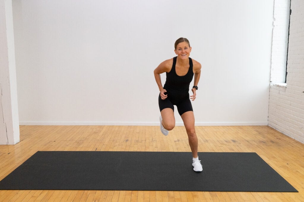 woman performing a lateral bound as part of postnatal fitness test