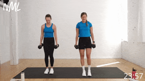 two women performing reverse lunge with a bicep curl as example of strength training exercises 