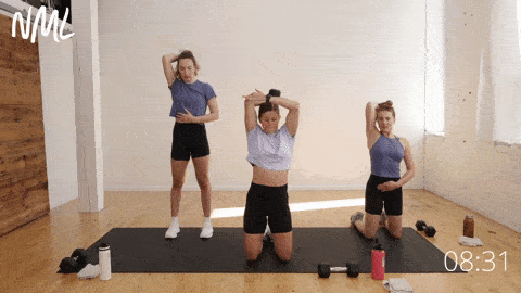 three women performing isolated tricep extensions with one arm