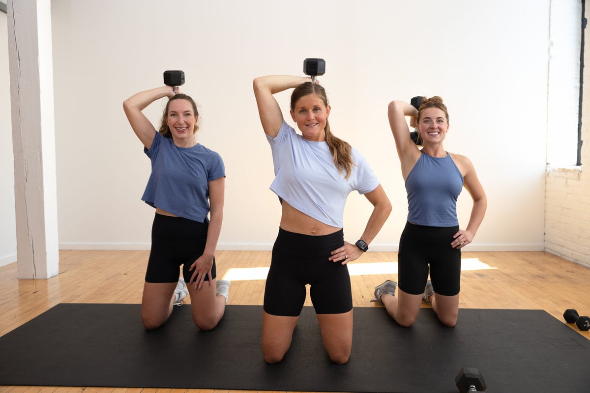 three women performing a single arm overhead tricep extension as part of unilateral workout
