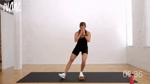 postpartum woman performing a single leg squat as part of running postpartum fitness assessment