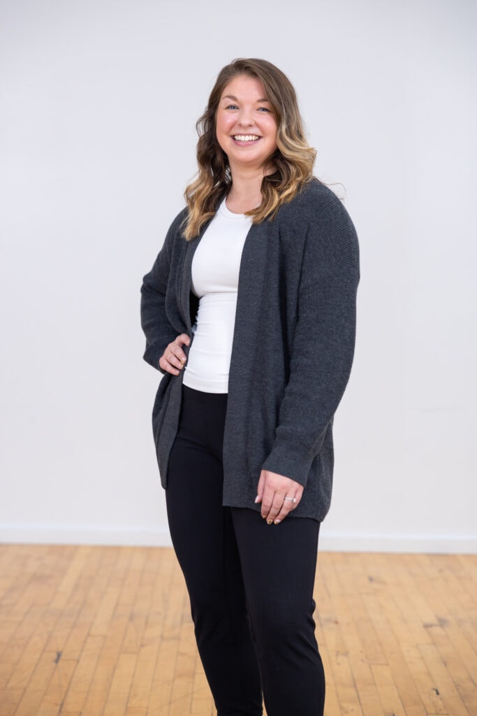 Woman wearing long gray sweater from lululemon